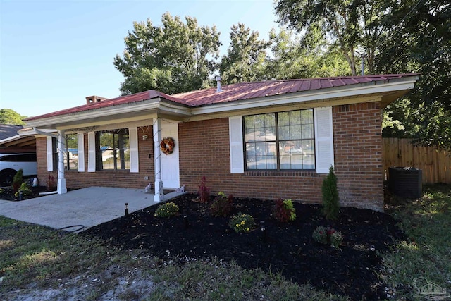 ranch-style home with central AC and a patio area