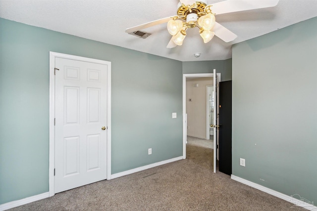 unfurnished bedroom with carpet flooring and ceiling fan