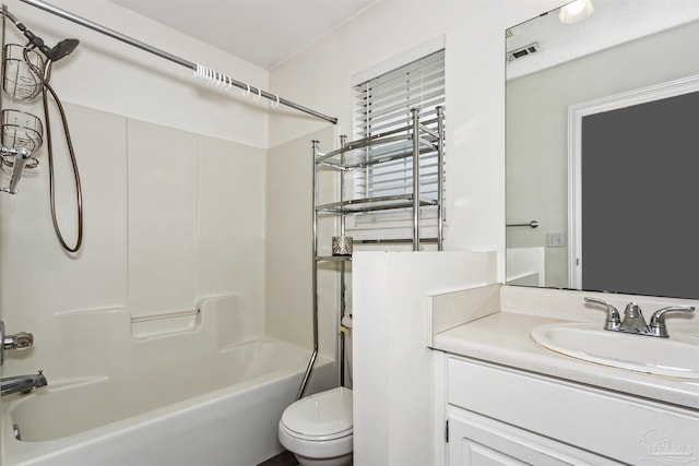 full bathroom featuring bathing tub / shower combination, vanity, and toilet