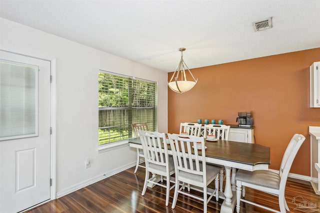 dining room with dark hardwood / wood-style floors