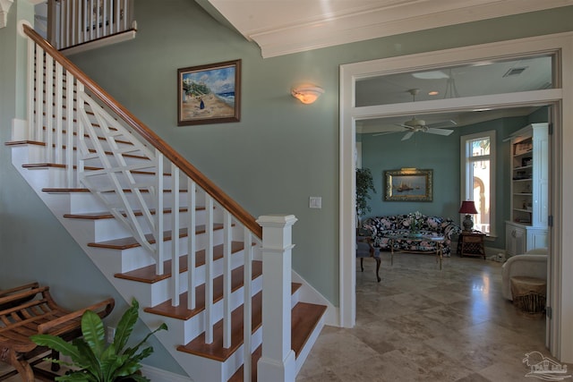 stairs with ceiling fan, ornamental molding, visible vents, and baseboards