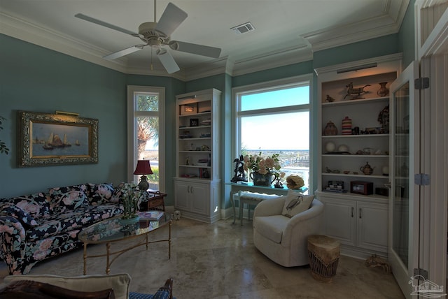 sitting room with ornamental molding, visible vents, and a ceiling fan