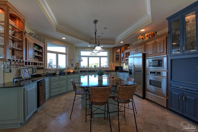 kitchen with a raised ceiling, dark countertops, glass insert cabinets, stainless steel appliances, and open shelves