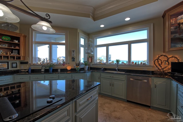 kitchen with dark stone counters, dishwasher, stovetop, pendant lighting, and a sink