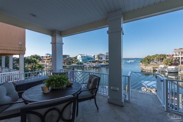 balcony featuring a water view