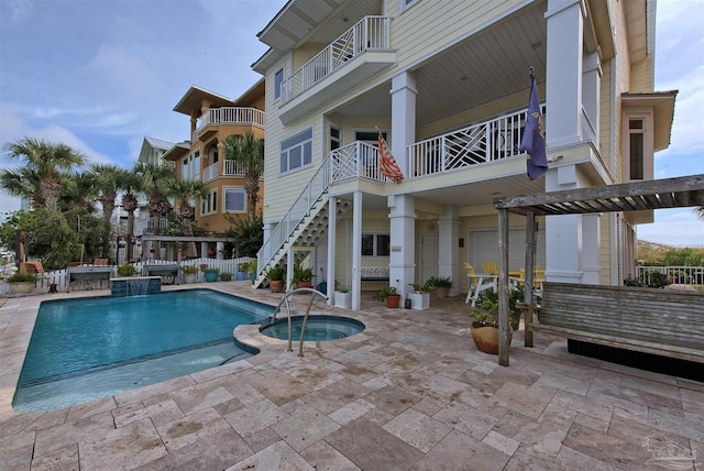 view of pool with an in ground hot tub, a patio, and a fenced in pool