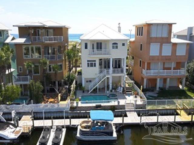 exterior space featuring a water view and stairs