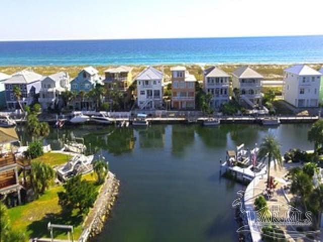 birds eye view of property with a residential view and a water view