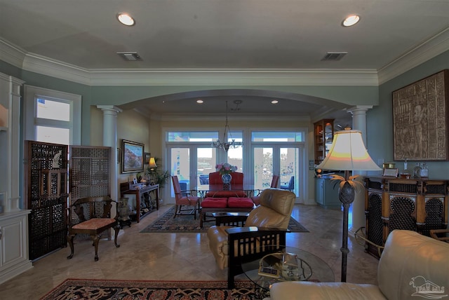 living area with decorative columns, visible vents, and arched walkways