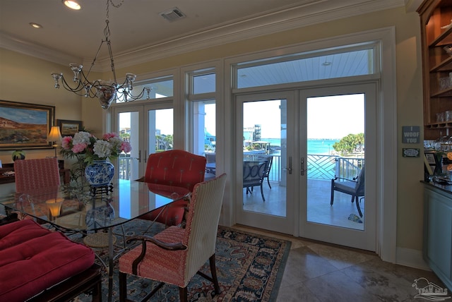 dining space featuring french doors, a healthy amount of sunlight, visible vents, and crown molding