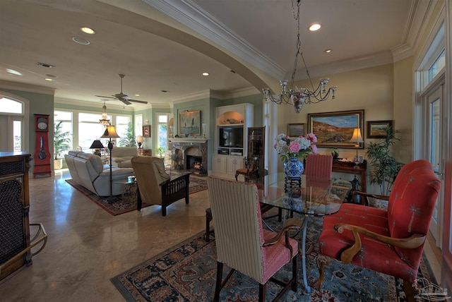 dining space featuring crown molding, recessed lighting, visible vents, and a fireplace