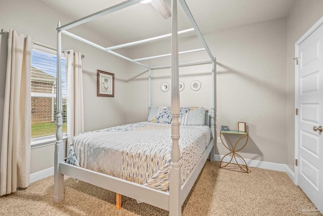 bedroom with carpet and baseboards