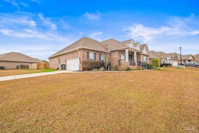 view of front of property with a garage, brick siding, concrete driveway, a residential view, and a front yard