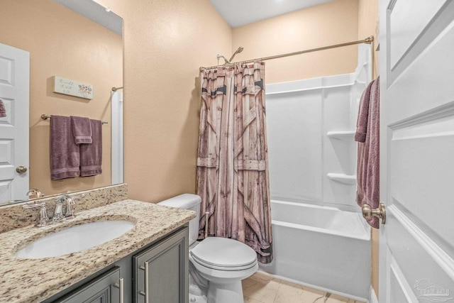 bathroom featuring toilet, shower / bath combo with shower curtain, and vanity