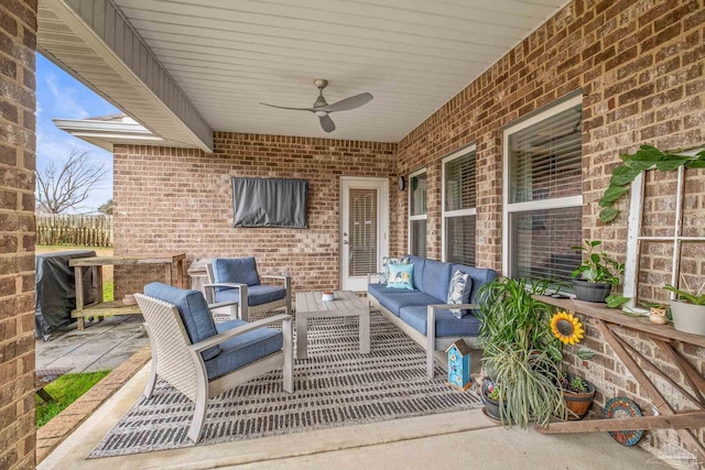 view of patio / terrace with ceiling fan, fence, and outdoor lounge area