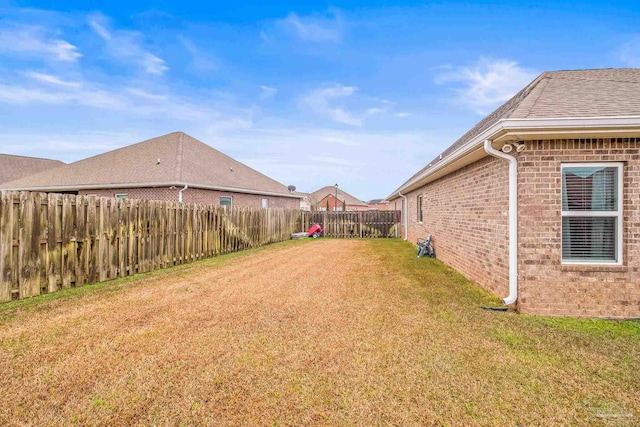 view of yard with a fenced backyard