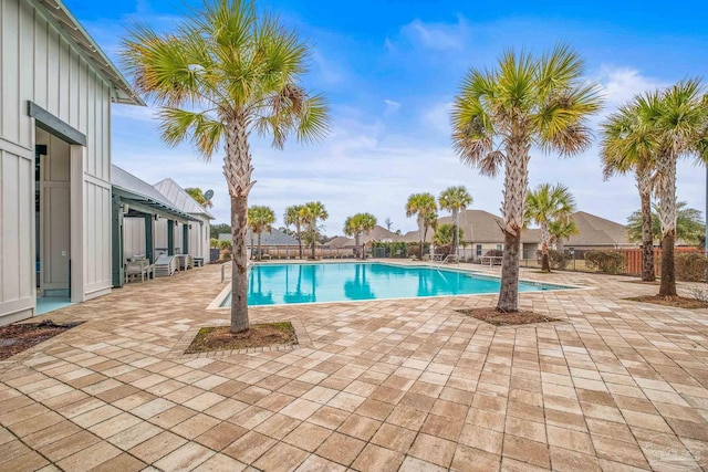 pool featuring a patio and fence