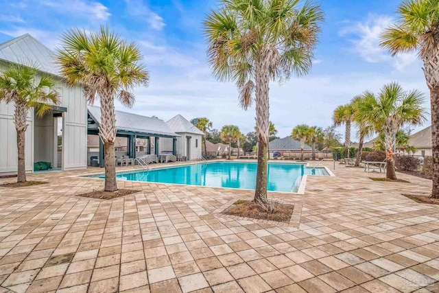 pool featuring a patio area and fence