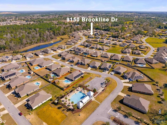 birds eye view of property with a residential view