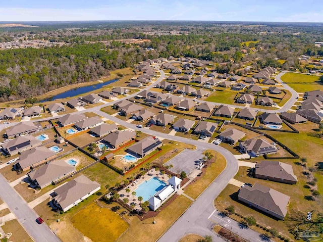 birds eye view of property with a residential view