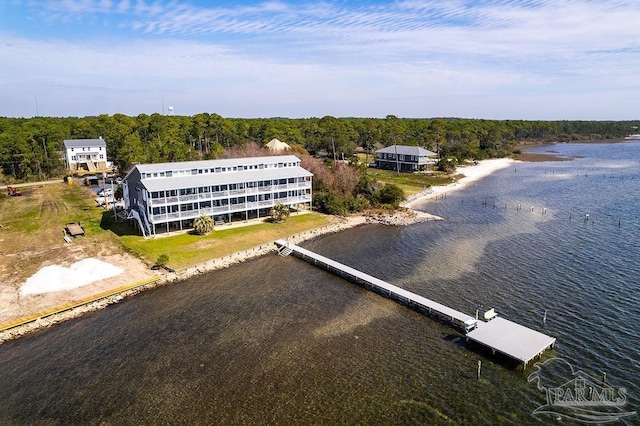 drone / aerial view featuring a water view and a forest view