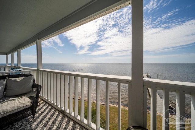 balcony featuring a water view