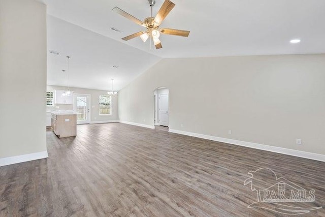 unfurnished living room featuring ceiling fan, dark hardwood / wood-style flooring, and lofted ceiling