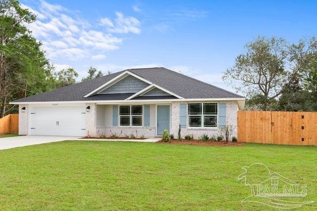 view of front facade with a garage and a front lawn