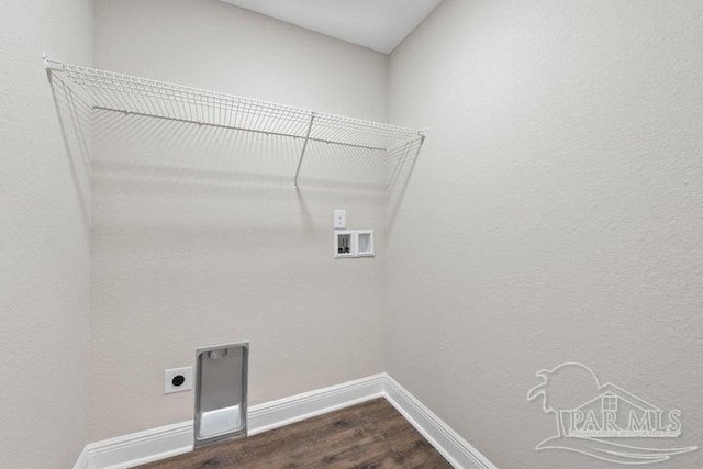 laundry area with washer hookup, electric dryer hookup, and dark wood-type flooring