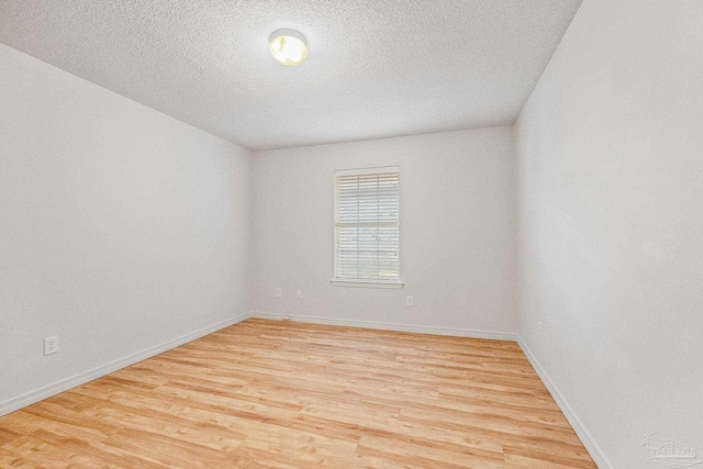 6240 Tributary St, Pensacola, FL 32526 - spare room with light hardwood / wood-style floors and a textured ceiling