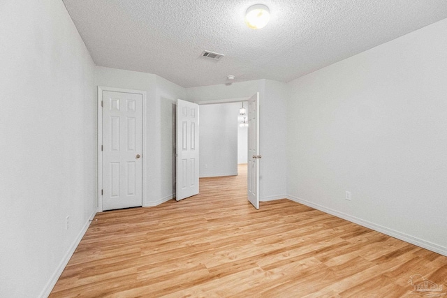 6240 Tributary St, Pensacola, FL 32526 - unfurnished bedroom featuring a textured ceiling and light wood-type flooring