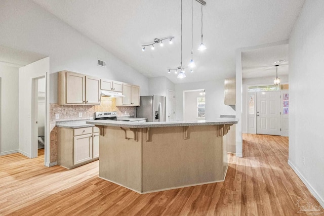 6240 Tributary St, Pensacola, FL 32526 - kitchen featuring stainless steel appliances, light brown cabinetry, and hanging light fixtures