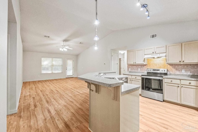 6240 Tributary St, Pensacola, FL 32526 - kitchen with decorative light fixtures, backsplash, a kitchen breakfast bar, electric range, and light hardwood / wood-style flooring