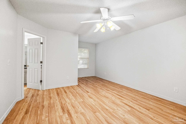 6240 Tributary St, Pensacola, FL 32526 - empty room with a textured ceiling, light hardwood / wood-style flooring, and ceiling fan