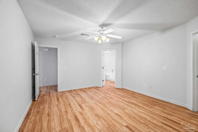 6240 Tributary St, Pensacola, FL 32526 - unfurnished bedroom with ceiling fan, ensuite bath, a textured ceiling, and light hardwood / wood-style flooring
