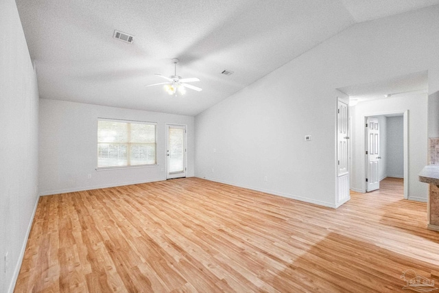 6240 Tributary St, Pensacola, FL 32526 - unfurnished room featuring vaulted ceiling, ceiling fan, and light wood-type flooring