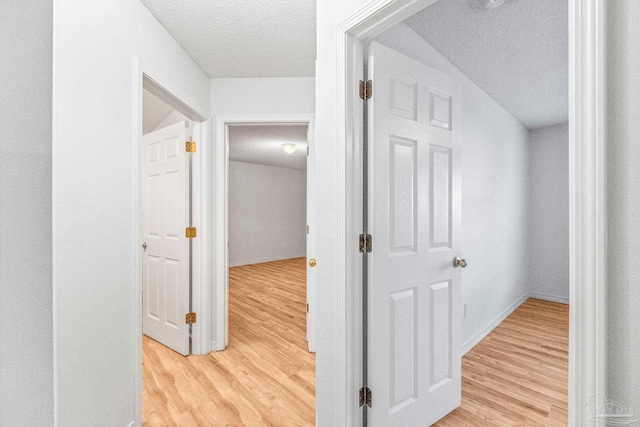6240 Tributary St, Pensacola, FL 32526 - hall with a textured ceiling and light wood-type flooring
