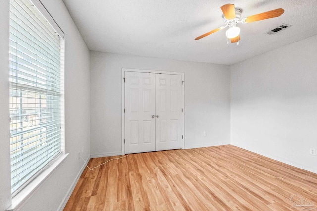6240 Tributary St, Pensacola, FL 32526 - spare room featuring hardwood / wood-style flooring, ceiling fan, and a textured ceiling