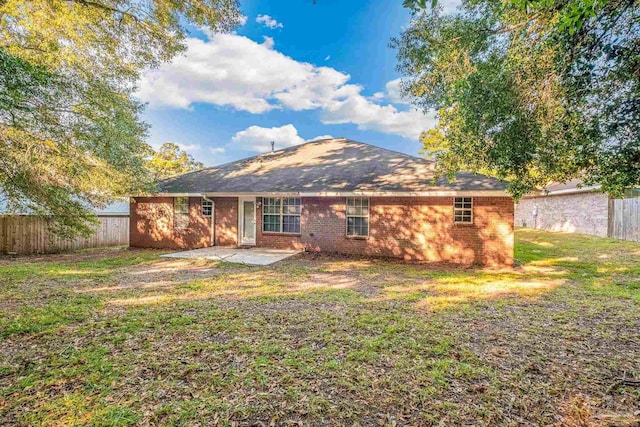 6240 Tributary St, Pensacola, FL 32526 - back of property with a patio area and a lawn