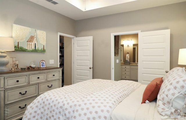 bedroom featuring ensuite bath