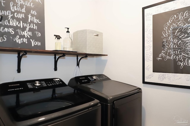 laundry area with washing machine and clothes dryer