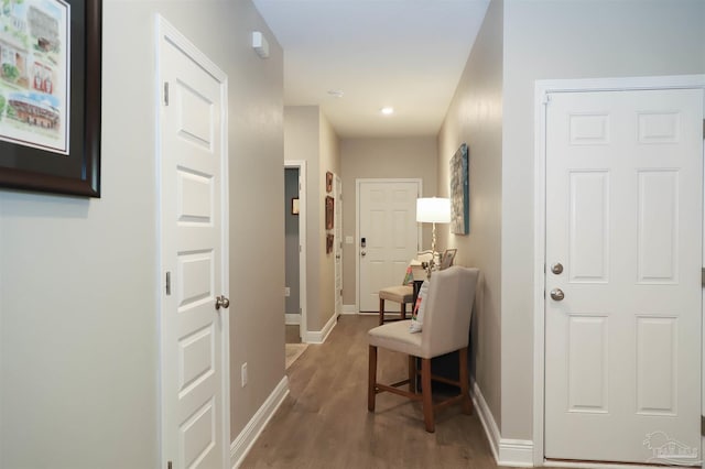 hall with dark hardwood / wood-style floors