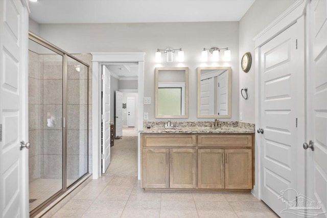 1504 Cadence Loop, Cantonment, FL 32533 - bathroom featuring a stall shower, tile patterned flooring, and double vanity