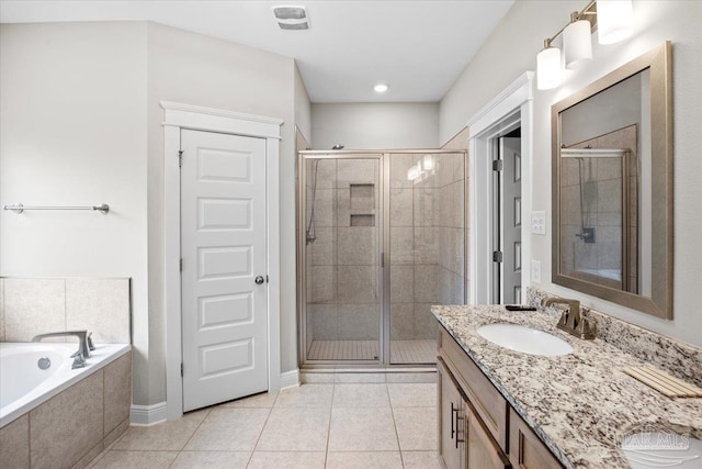 1504 Cadence Loop, Cantonment, FL 32533 - bathroom with a stall shower, tile patterned floors, double vanity, and a bath