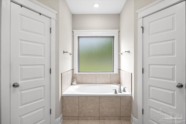 1504 Cadence Loop, Cantonment, FL 32533 - full bathroom featuring a garden tub and tile patterned flooring