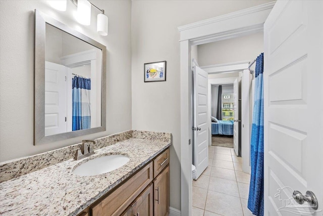 1504 Cadence Loop, Cantonment, FL 32533 - ensuite bathroom with tile patterned floors, vanity, and toilet