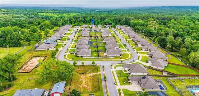 1504 Cadence Loop, Cantonment, FL 32533 - aerial perspective of suburban area with a heavily wooded area