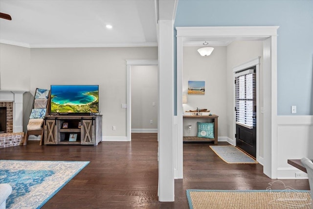 1504 Cadence Loop, Cantonment, FL 32533 - entryway featuring crown molding, a fireplace, wood finished floors, baseboards, and recessed lighting