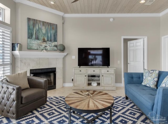 living room featuring wood ceiling, crown molding, a fireplace, and light tile patterned flooring