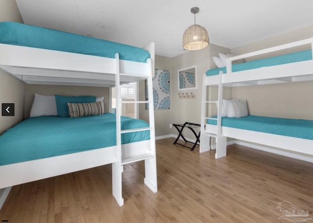 bedroom with wood-type flooring